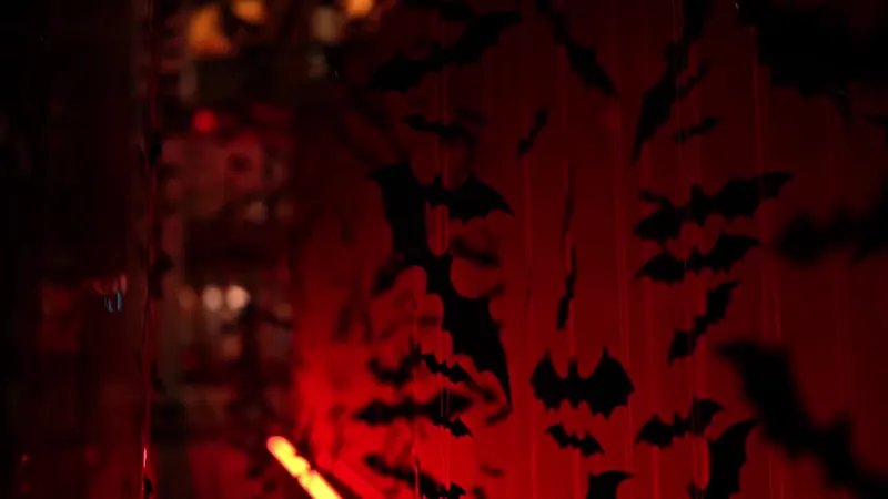Bat silhouettes under red light at The Batman event